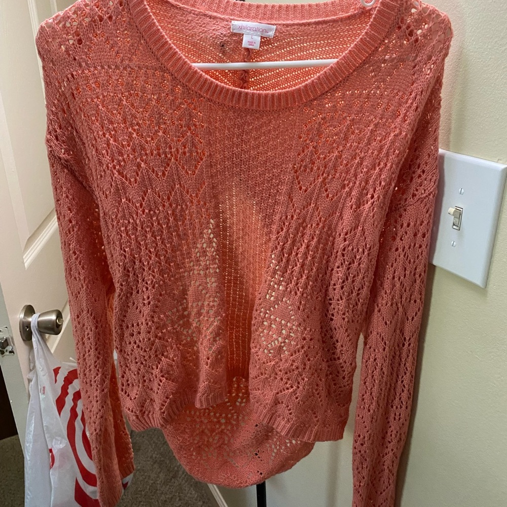 Pink light sweater open in back